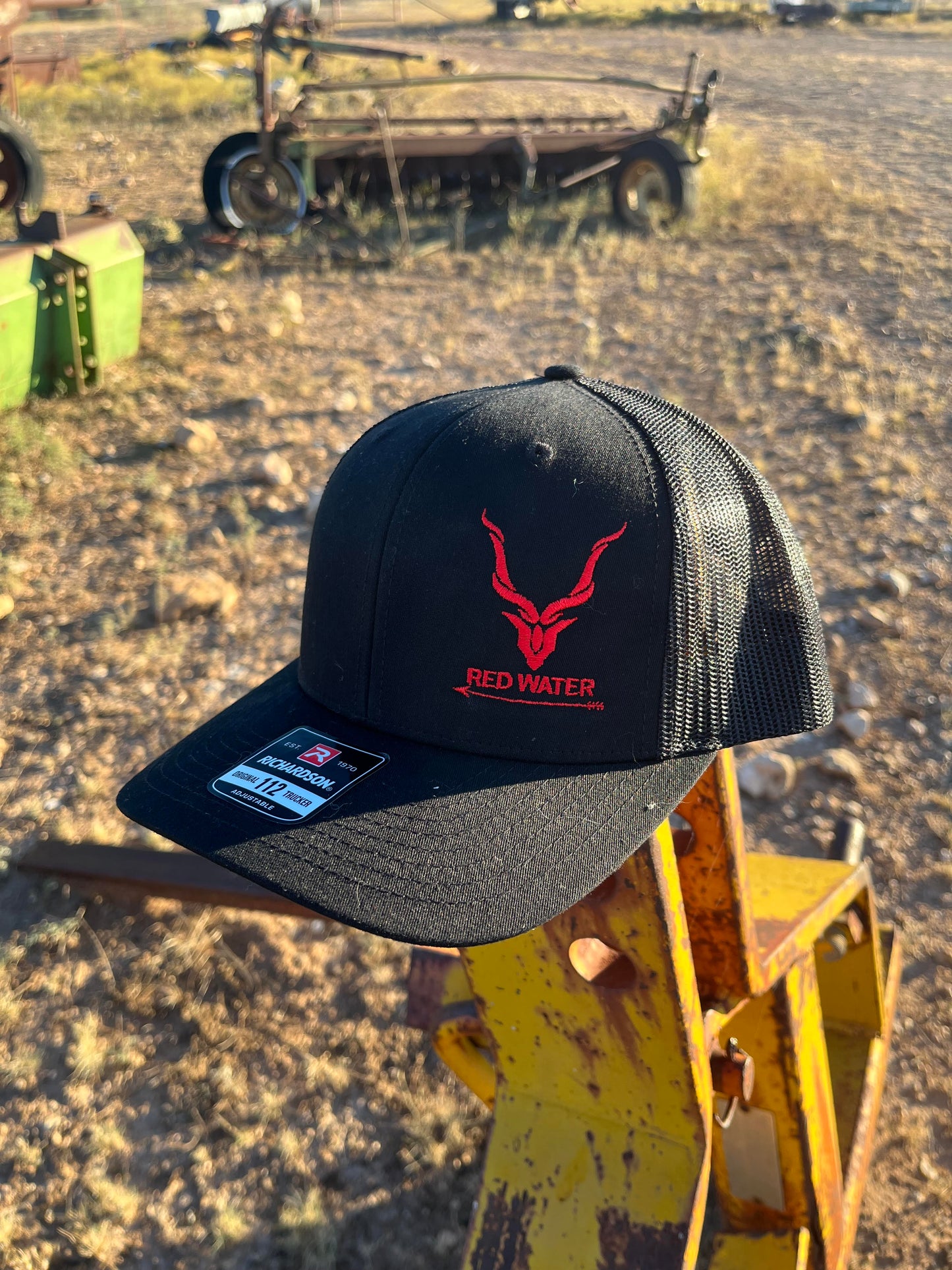 Black 112 Hat Red Water logo